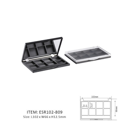 Black Rectangular Eyeshadow Palette Containing Eight Rectangular sections and a mirror or window on the cap