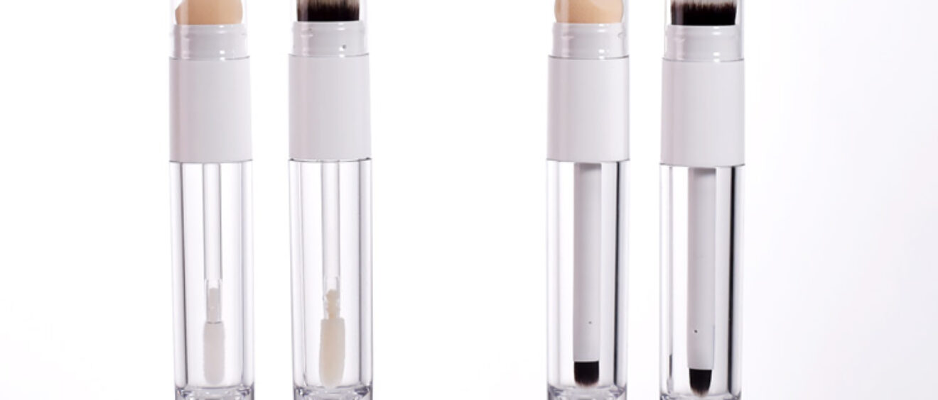 empty double ended plastic bottle with brush or sponge applicator as liquid foundation concealer packaging